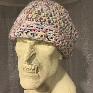 Hand-made knitted multicolored beanie.